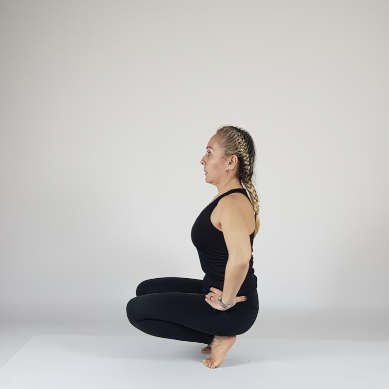Garland Pose Hands on Hips